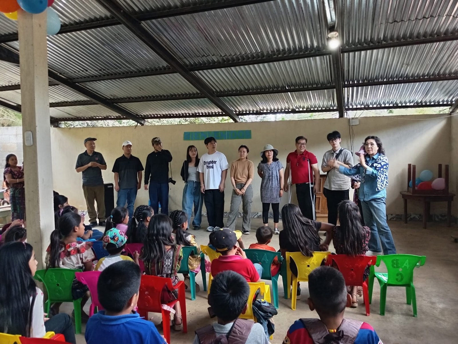 Children at an outdoor mission service